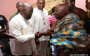 Nana Agyen Frimpong II, chief of Tafo in a handshake with Nana Addo