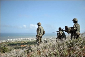 Soldiers with the African Union mission in Somalia look out for al-Shabab fighters