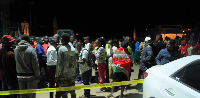 Onlookers gathered at  the scene where fueling station manager allagedly shot himself dead