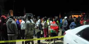 Onlookers gathered at  the scene where fueling station manager allagedly shot himself dead