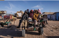 Sudanese refugees prepare to ride back to their temporary shelter in Oure Cassoni, Chad