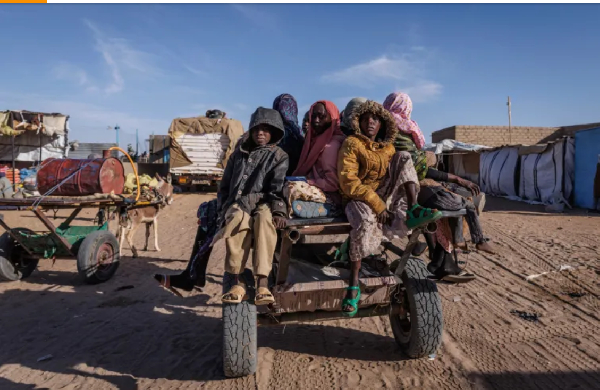 Sudanese refugees prepare to ride back to their temporary shelter in Oure Cassoni, Chad