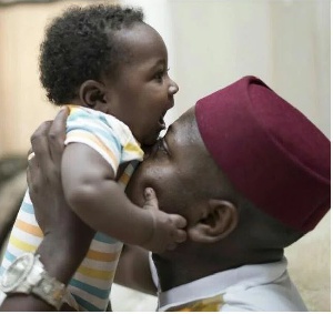 Flowking Stone playing with his son