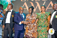 President Nana Akufo-Addo presenting an award to Ms Vivian Opoku-Kyeremeh