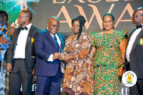 President Nana Akufo-Addo presenting an award to Ms Vivian Opoku-Kyeremeh