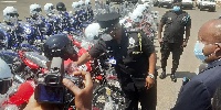 IGP James Oppong-Boanuh inspecting the motorbikes donated by the Synagogue Church of All Nations