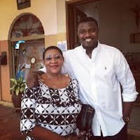 John Dumelo and his mother as she turns 65