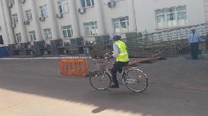 Ras Mubarak, MP for Kumbugu riding his bike to parliament