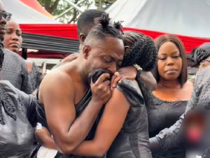 Choirmaster getting consoled by one of his daughters