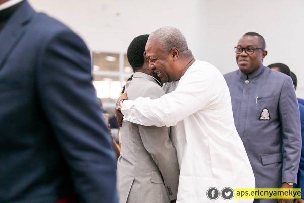 Former President Mahama in an embrace with outgoing Pentecost chairman Prof. Opoko Onyinah
