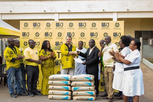 Works Manager of Ghacem-Takoradi, Jorn Johansen (left) presenting letter of donation