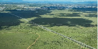 The Nairobi-Malaba Standard Gauge Railway crossing Nairobi National Park in Kenya, built by China