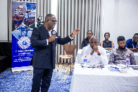 Stanley Ahorlu speaking at  a cross section of stakeholders