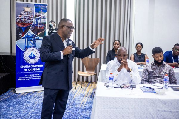 Stanley Ahorlu speaking at  a cross section of stakeholders