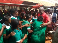 Student nurses heartily hug the Vice President, Paa Kwesi Bekoe Amissah-Arthur