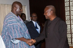 Suspended NPP chairman,  Paul Afoko [L] in a handshake with President Mahama