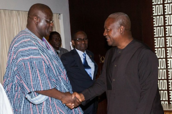 Suspended NPP chairman,  Paul Afoko [L] in a handshake with President Mahama