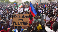Nigeriens participate in a march called by supporters of coup leader Gen. Abdourahmane Tchiani