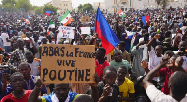 Nigeriens participate in a march called by supporters of coup leader Gen. Abdourahmane Tchiani