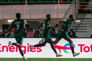 Players of Nigeria celebrating their opener