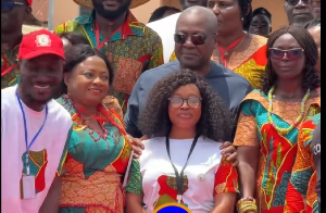 Mahama during the session, gently pulled the young lady back to stand in front of him