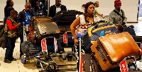 Nigerians queue at passport control at the O R Tambo International Airport in Johannesburg