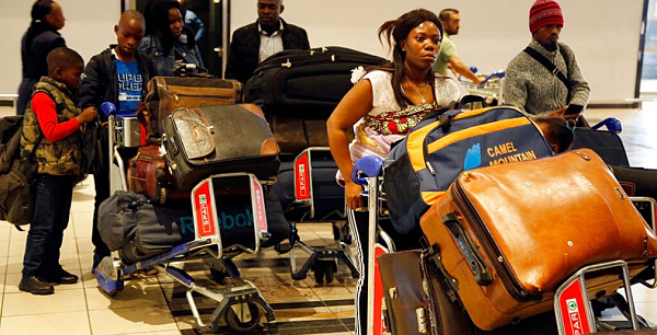 Nigerians queue at passport control at the O R Tambo International Airport in Johannesburg