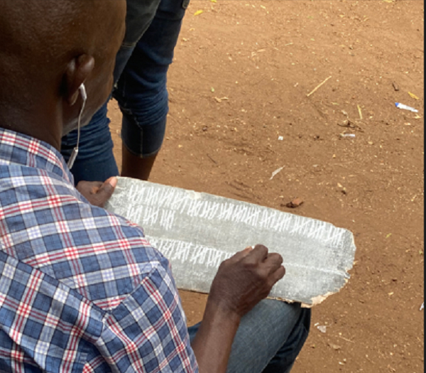 Photo of a man writing