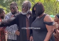 Ebony's father being consoled by his wife and son