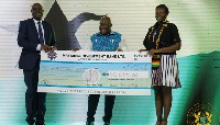 President Akufo-Addo presents the award winner, Vanessa Aisha Liman, with GHC50,000