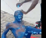 Watch as angry youth forces man painted in NPP colors to beg for money to wash off paint