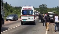 A government ambulance speeding past the accident scene