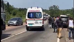 A government ambulance speeding past the accident scene