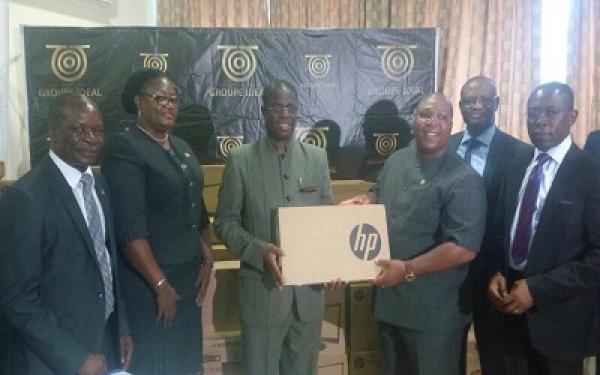 Prof Joseph Ghartey Ampiah (3rd from left) receives the donation from Dr Dzani (3rd from right)