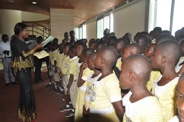 MP for North Dayi, Joyce Tetteh, interacting with the students from St Joseph R.C Basic Schools