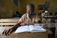 File photo: A school pupil wearing a nose mask