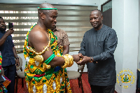 Awulae Blay IX shaking hands with the minister