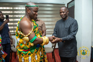 Awulae Blay IX shaking hands with the minister
