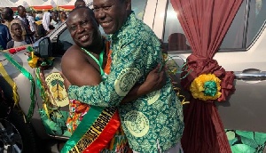 COCOBOD CEO in an embrace with the Best Cocoa Farmer after the presentation