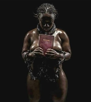 Naked woman holding a Bible