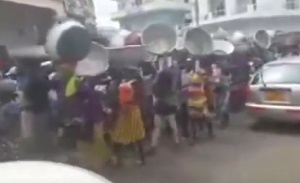 Head porters in Kumasi marching in protest of increased cost of utilities and consumables