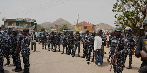Police officers gather at the scene of a gunmen attack in Gari Ya Waye community Police officers gather at the scene of a gunmen attack in Gari Ya Waye community