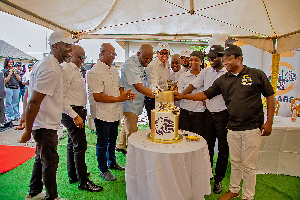Founder of Dzata Cement, Ibrahim Mahama with other dignitaries cutting a cake