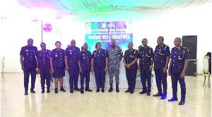 Christiana Odi Adjei, middle left, Emmanuel Ohene, middle right flanked by some management staff