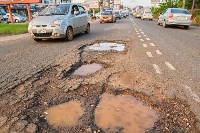 A road with potholes | File photo