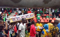 Some supporters of the NDC carrying a coffin, with pictures of Nana Akufo-Addo