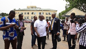 Koku Anyidoho (in white shirt) leaving the Police Headquarters after being summoned
