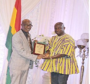 Medeama President, Moses Armah (in a smock) receiving his award