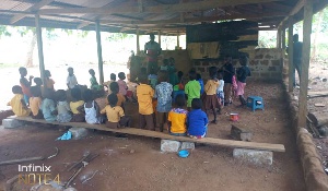 Kwabena Dwomo Krom pupils sitting on the bare floor in class