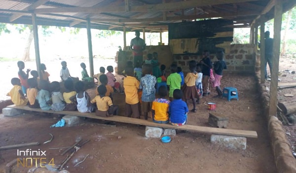 Kwabena Dwomo Krom pupils sitting on the bare floor in class